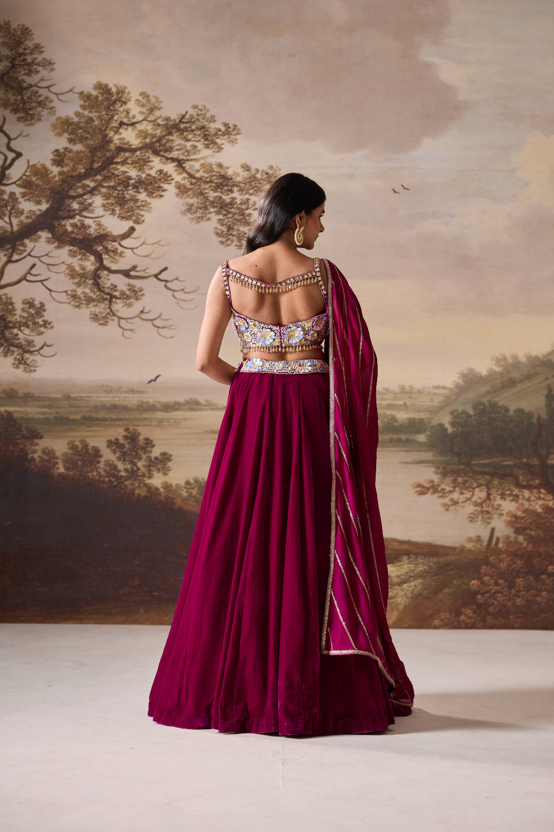 Purple emb bustier and velevt lehnga set